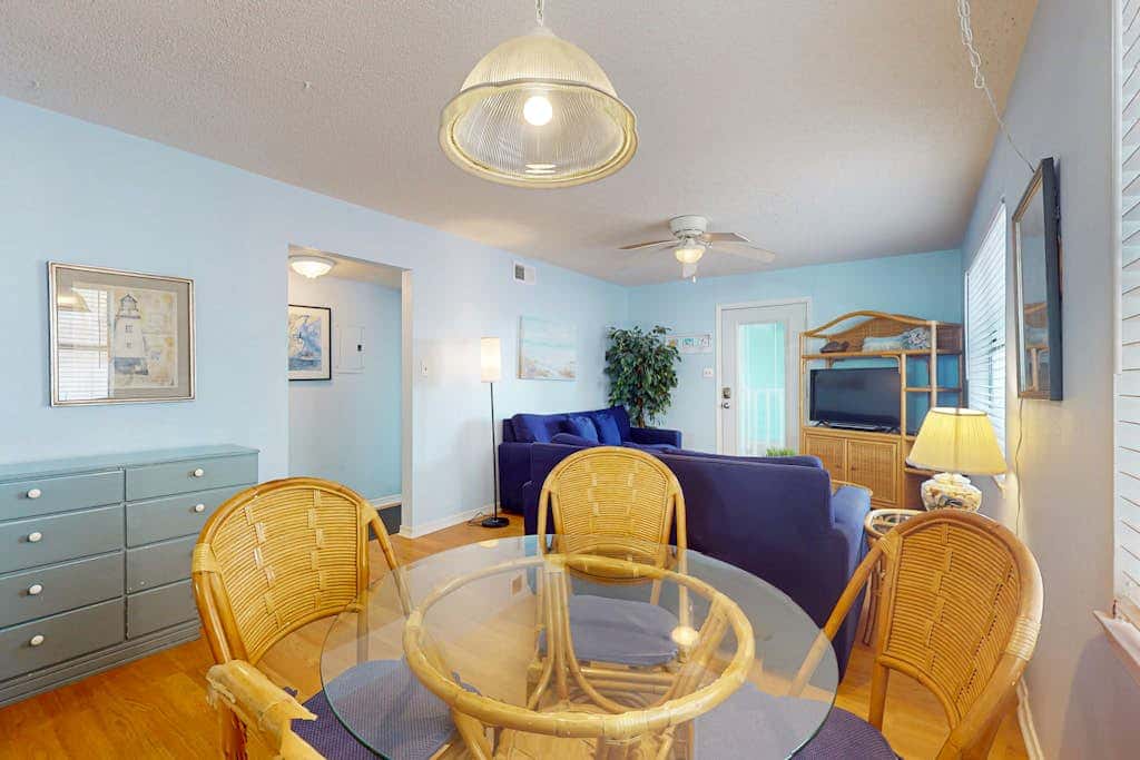 Waterfront condo with a furnished balcony, peek-a-boo Gulf views, & shared pools