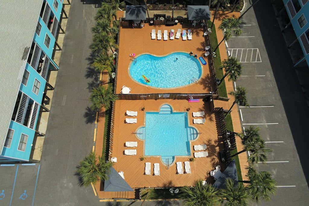 Waterfront condo with a furnished balcony, peek-a-boo Gulf views, & shared pools