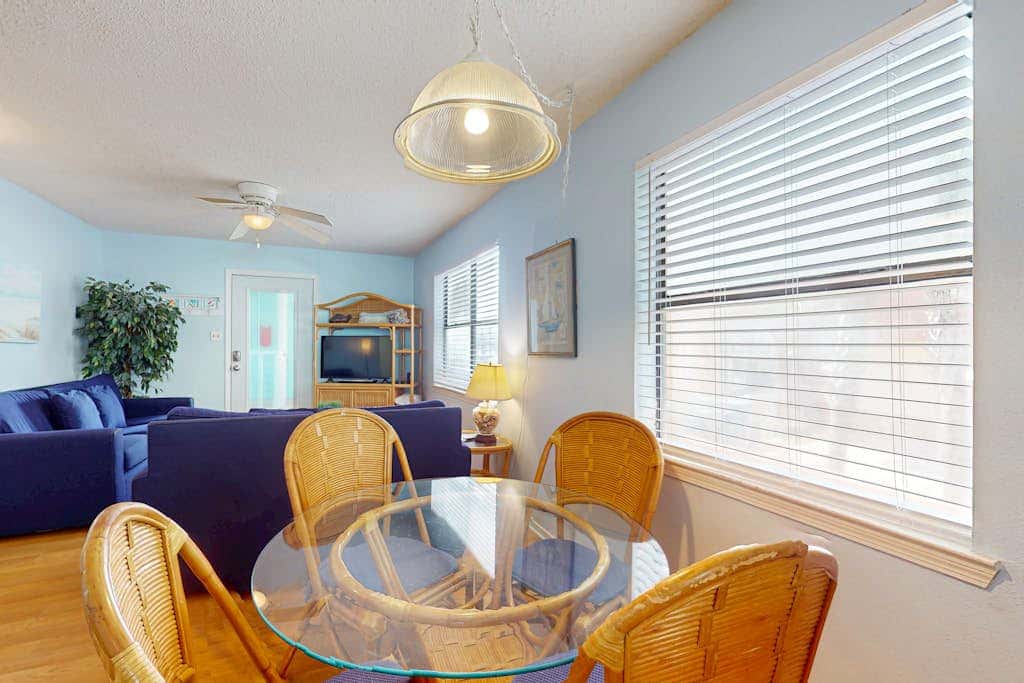 Waterfront condo with a furnished balcony, peek-a-boo Gulf views, & shared pools
