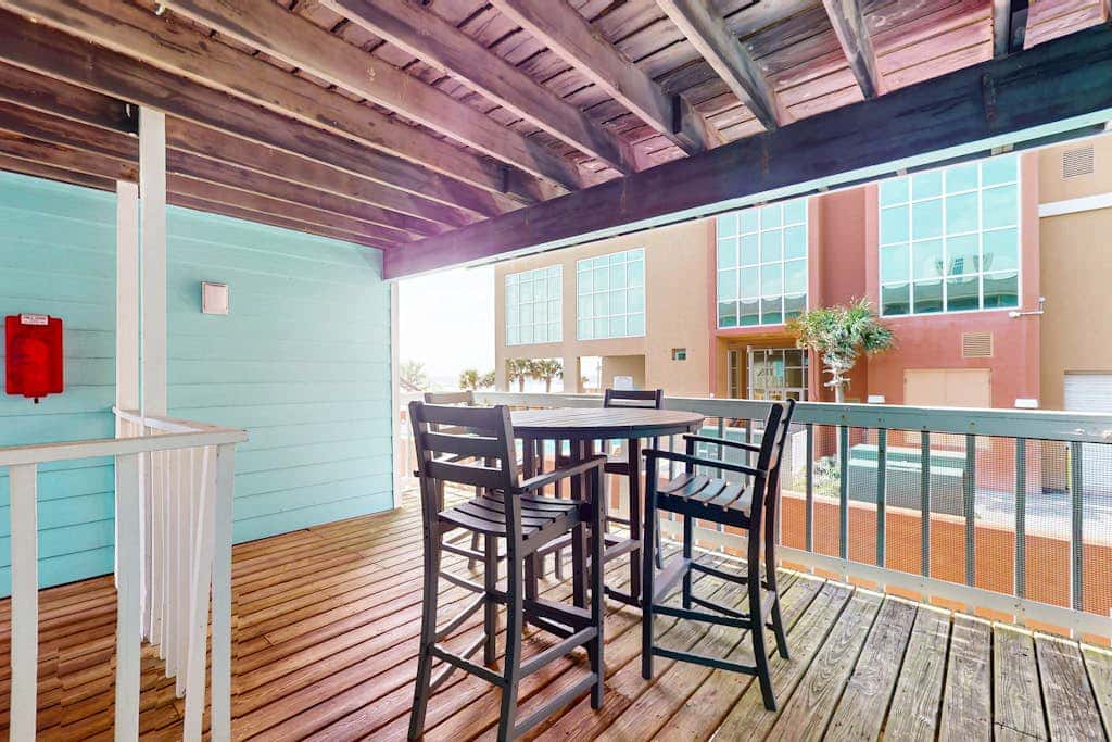 Waterfront condo with a furnished balcony, peek-a-boo Gulf views, & shared pools