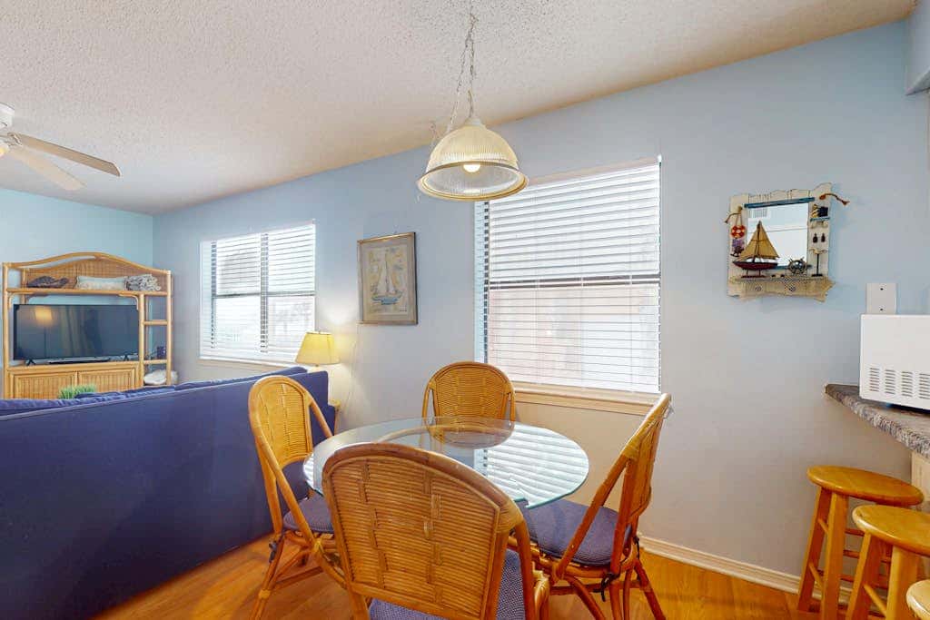 Waterfront condo with a furnished balcony, peek-a-boo Gulf views, & shared pools