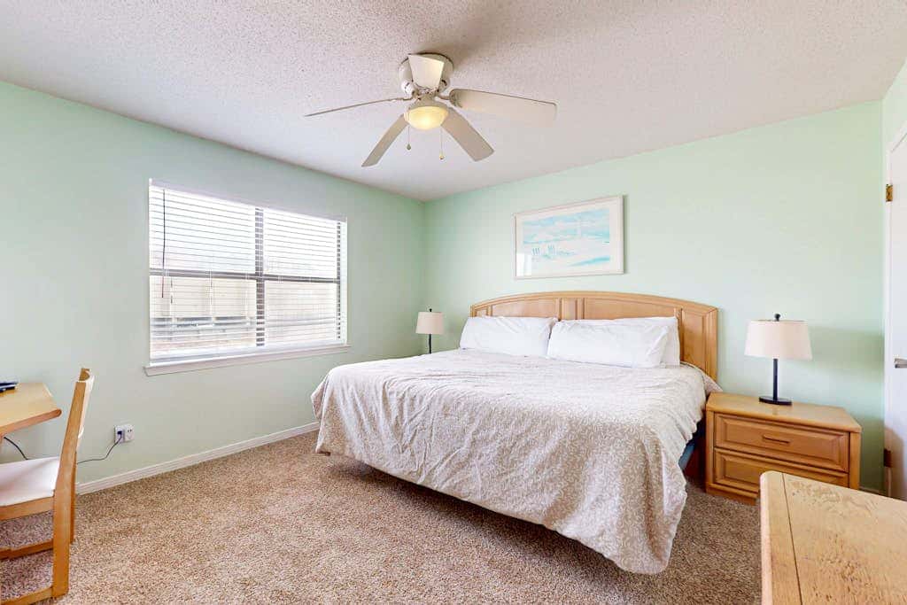 Waterfront condo with a furnished balcony, peek-a-boo Gulf views, & shared pools