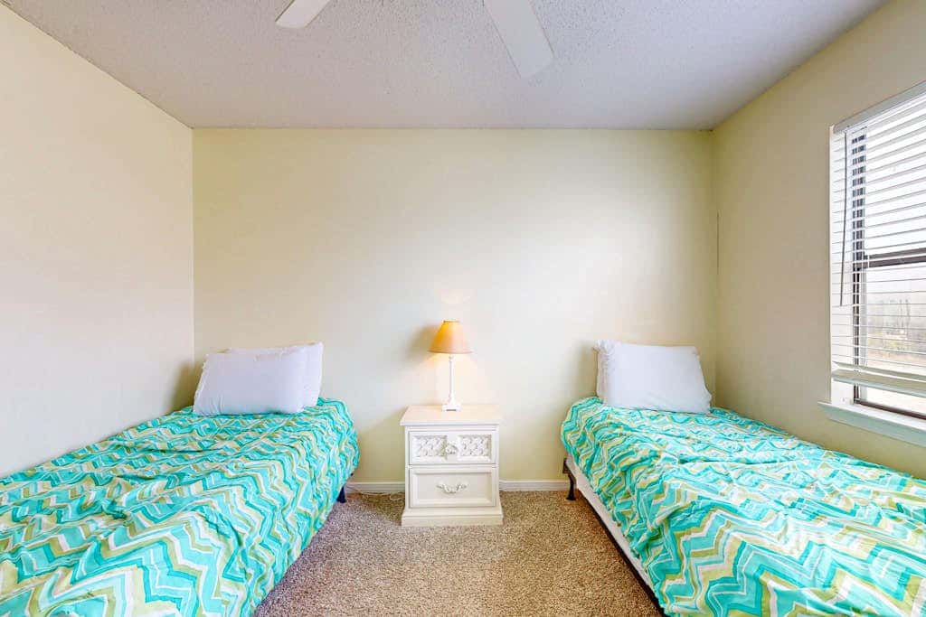 Waterfront condo with a furnished balcony, peek-a-boo Gulf views, & shared pools