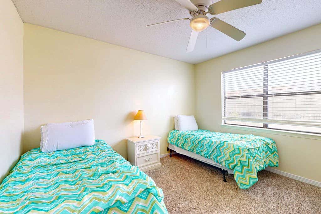 Waterfront condo with a furnished balcony, peek-a-boo Gulf views, & shared pools