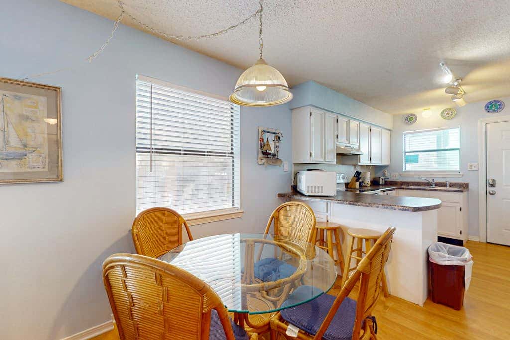 Waterfront condo with a furnished balcony, peek-a-boo Gulf views, & shared pools