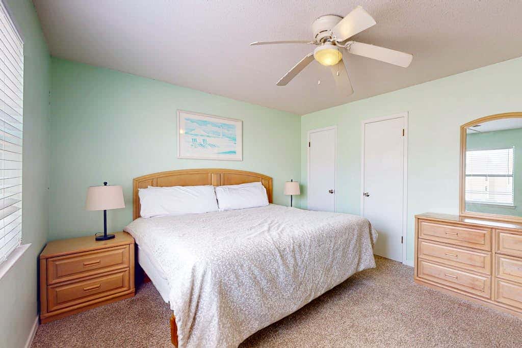 Waterfront condo with a furnished balcony, peek-a-boo Gulf views, & shared pools