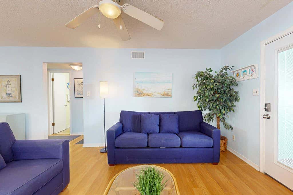 Waterfront condo with a furnished balcony, peek-a-boo Gulf views, & shared pools