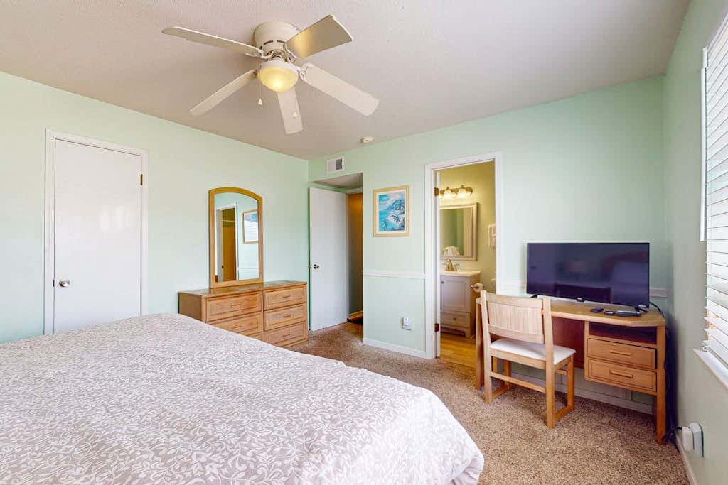 Waterfront condo with a furnished balcony, peek-a-boo Gulf views, & shared pools