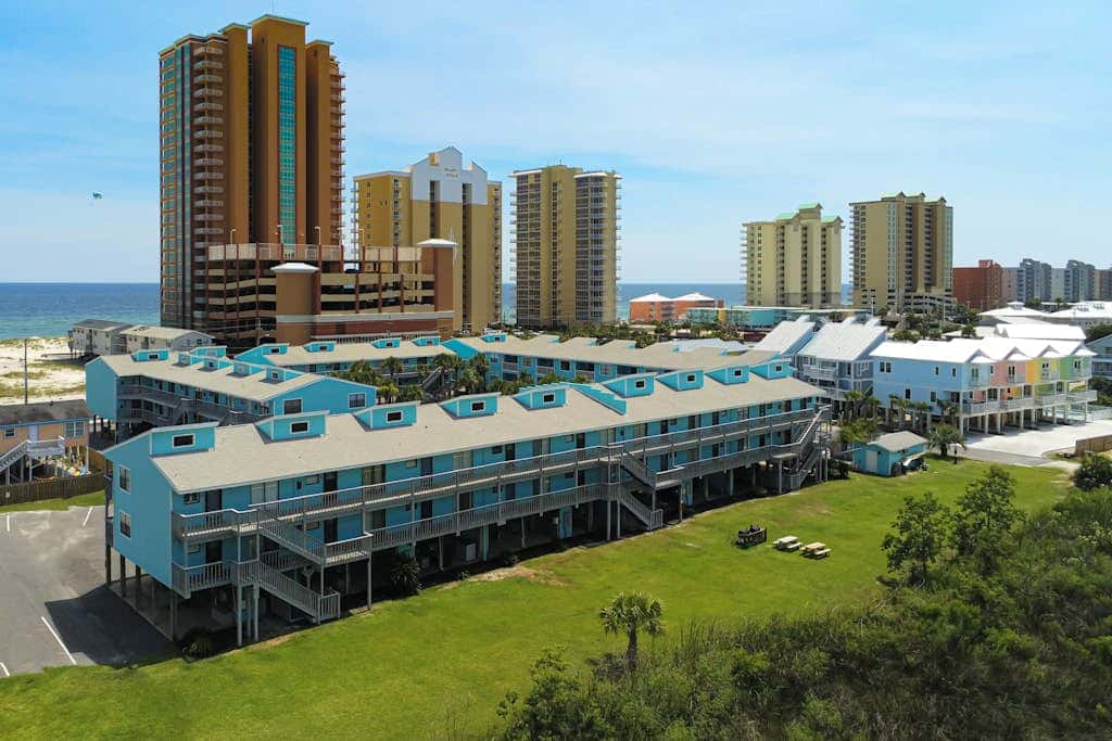 Waterfront condo with a furnished balcony, peek-a-boo Gulf views, & shared pools