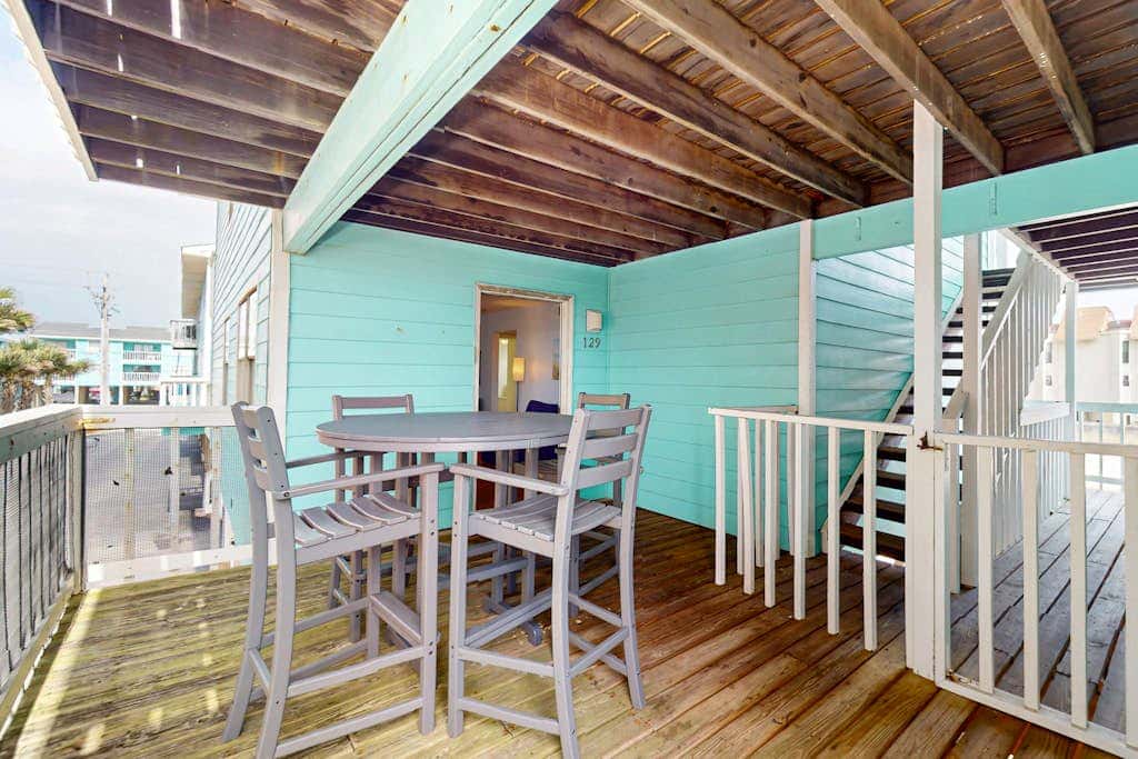 Waterfront condo with a furnished balcony, peek-a-boo Gulf views, & shared pools