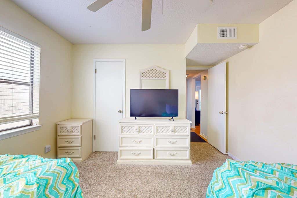 Waterfront condo with a furnished balcony, peek-a-boo Gulf views, & shared pools