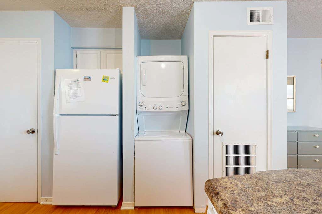 Waterfront condo with a furnished balcony, peek-a-boo Gulf views, & shared pools