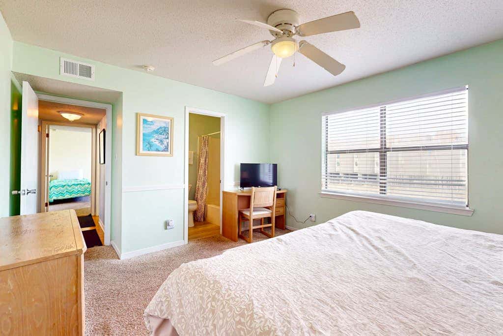 Waterfront condo with a furnished balcony, peek-a-boo Gulf views, & shared pools