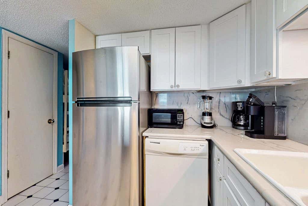 Gulf-front 3rd-floor condo with outdoor pool, central AC, & balcony