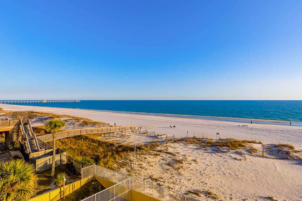 Gulf-front 3rd-floor condo with outdoor pool, central AC, & balcony