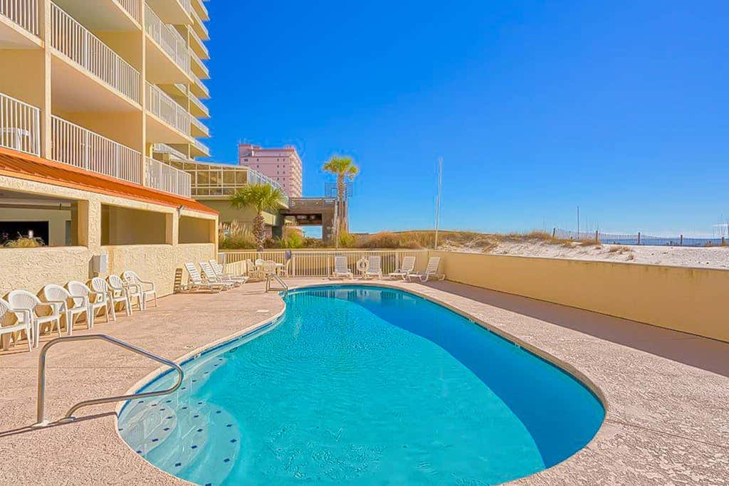 Gulf-front 3rd-floor condo with outdoor pool, central AC, & balcony