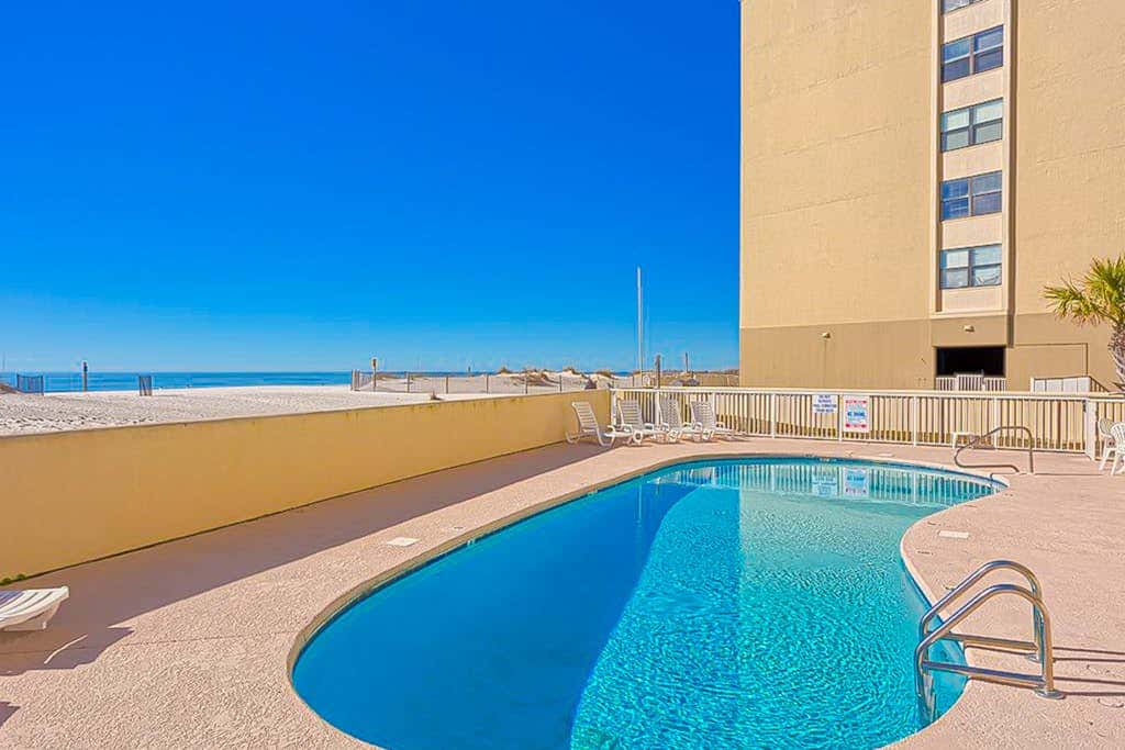 Gulf-front 3rd-floor condo with outdoor pool, central AC, & balcony