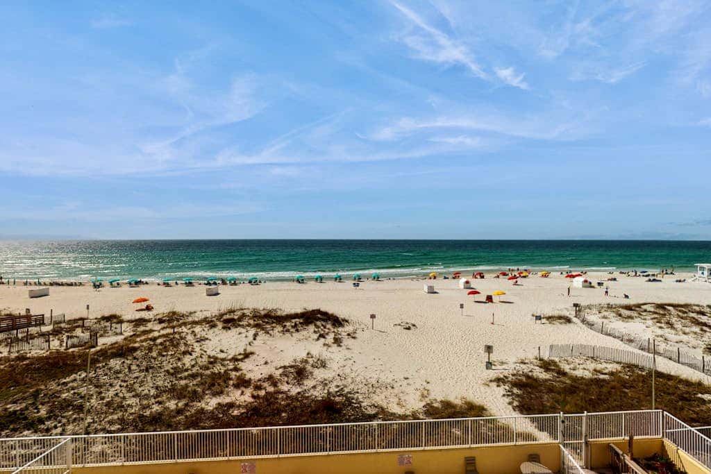 Gulf-front 3rd-floor condo with outdoor pool, central AC, & balcony