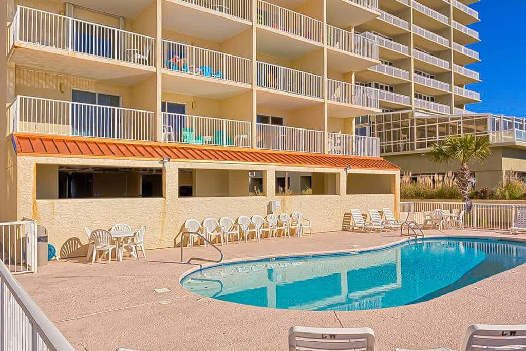 Gulf-front 3rd-floor condo with outdoor pool, central AC, & balcony