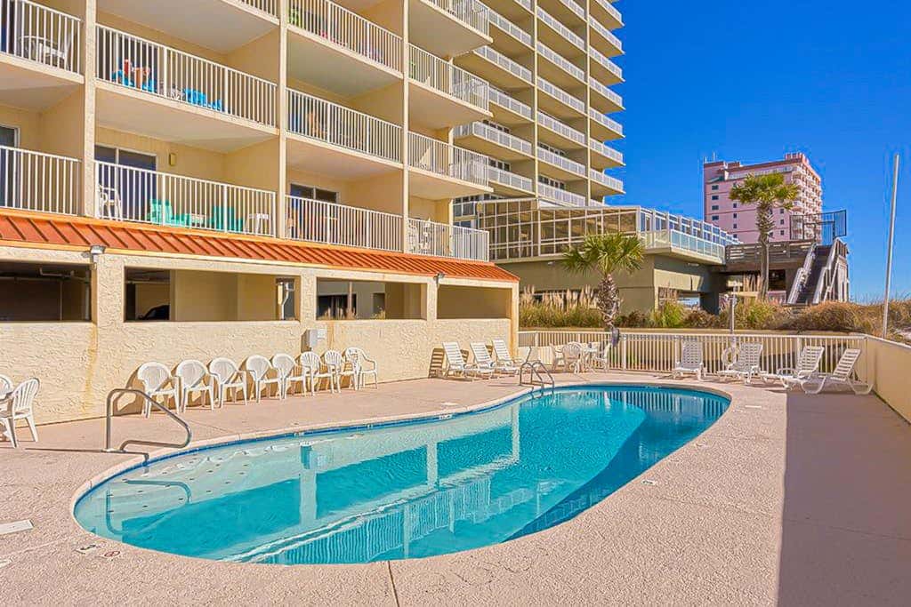 Gulf-front 3rd-floor condo with outdoor pool, central AC, & balcony