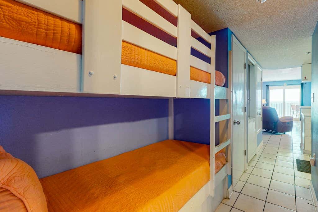 Clearwater condo with bunk room, pool, & balcony - walk to waves