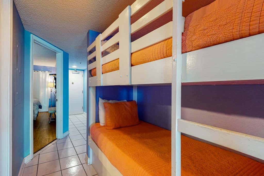 Clearwater condo with bunk room, pool, & balcony - walk to waves