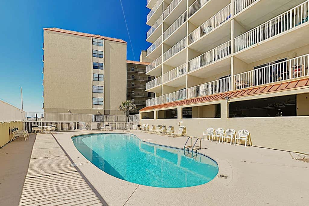 Clearwater condo with bunk room, pool, & balcony - walk to waves