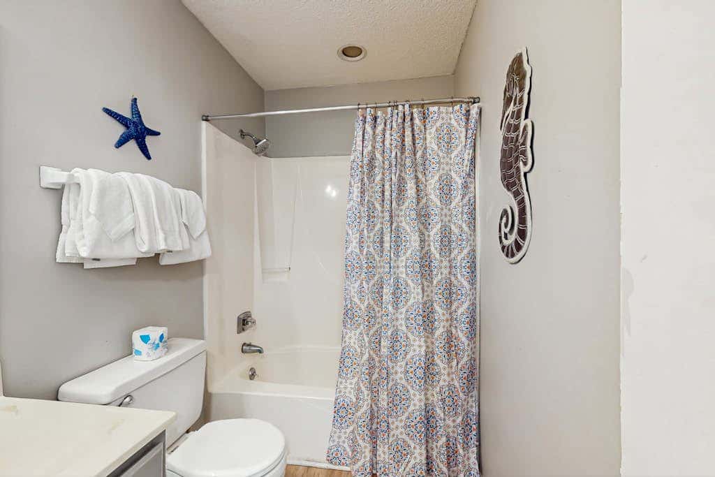Second Floor Condo with Shared Pool, Fast WiFi, Central AC, and Full Kitchen