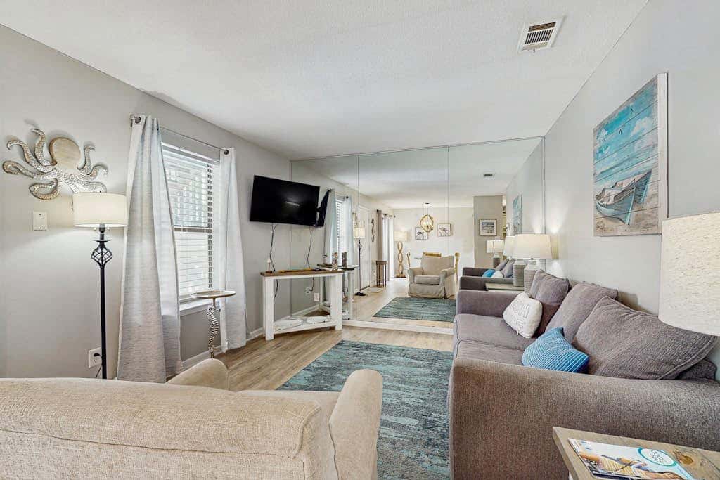 Second Floor Condo with Shared Pool, Fast WiFi, Central AC, and Full Kitchen