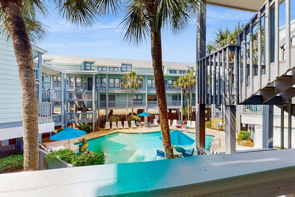 Second Floor Condo with Shared Pool, Fast WiFi, Central AC, and Full Kitchen
