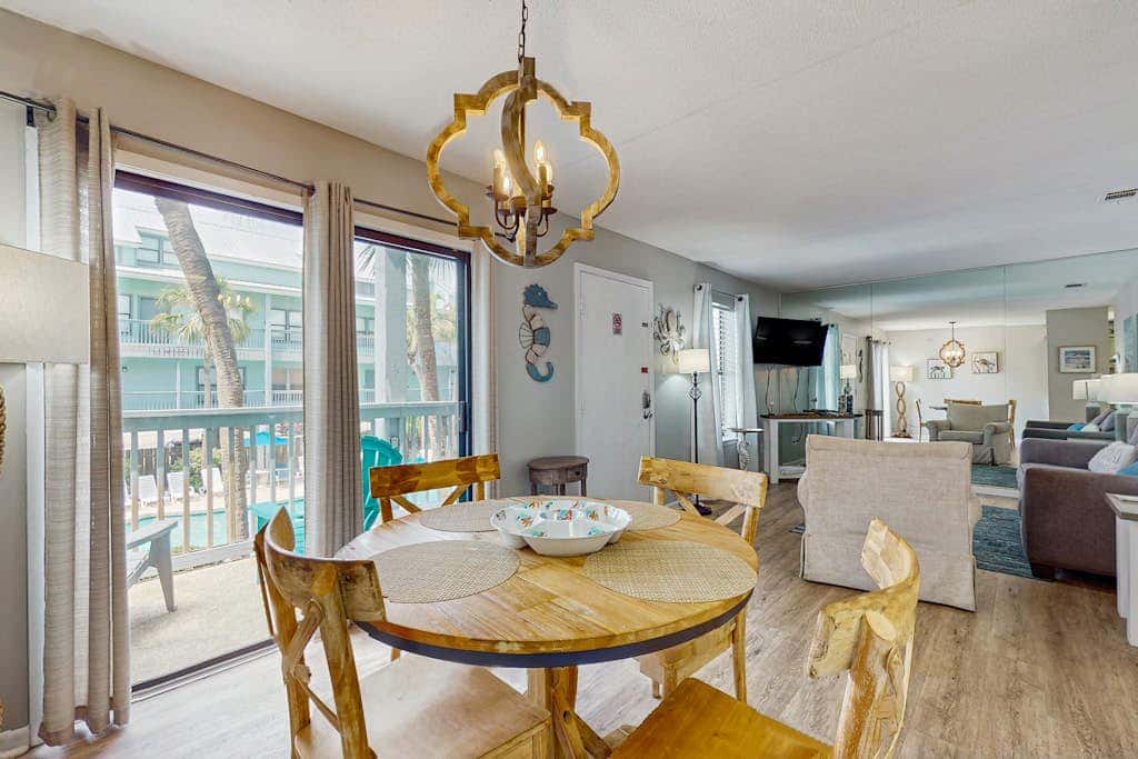 Second Floor Condo with Shared Pool, Fast WiFi, Central AC, and Full Kitchen