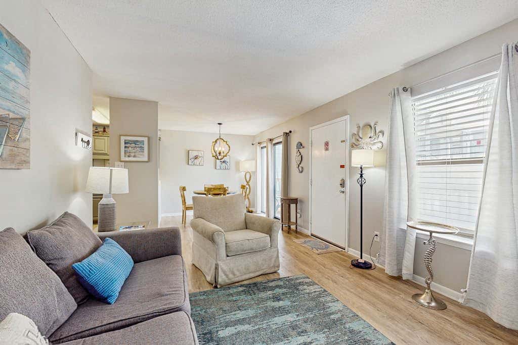 Second Floor Condo with Shared Pool, Fast WiFi, Central AC, and Full Kitchen