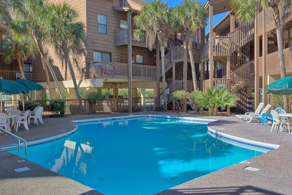 Second Floor Condo with Shared Pool, Fast WiFi, Central AC, and Full Kitchen