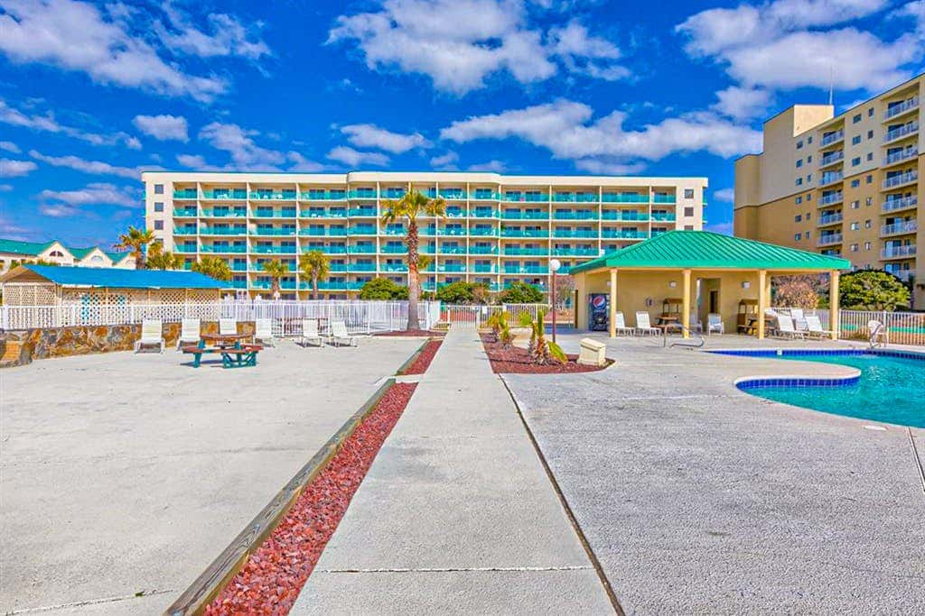 Gulf-view condo with 4 pools, hot tubs, beach access, central AC, & washer/dryer