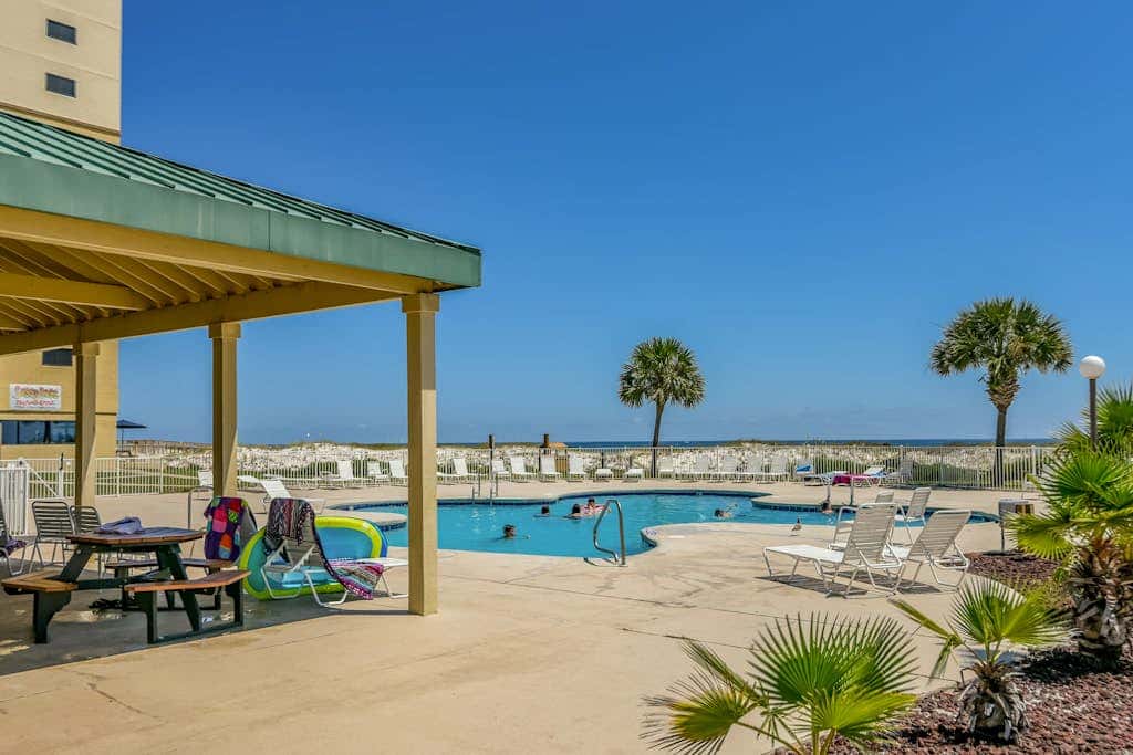 Gulf-view condo with 4 pools, hot tubs, beach access, central AC, & washer/dryer