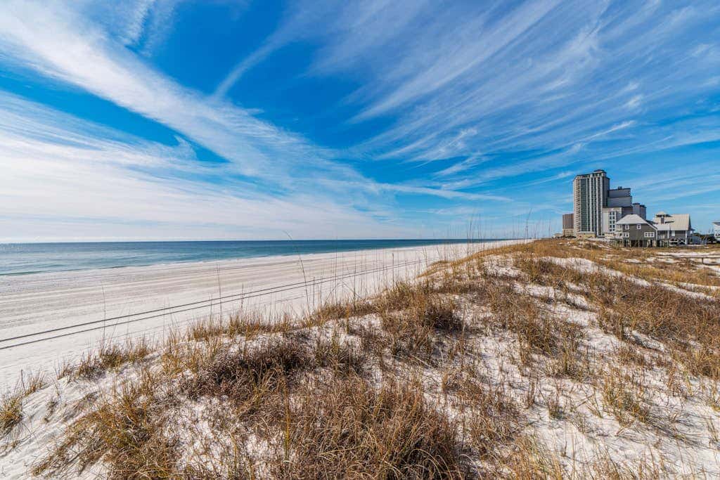 Spacious beachfront wedding-friendly home with multiple decks & shared pool