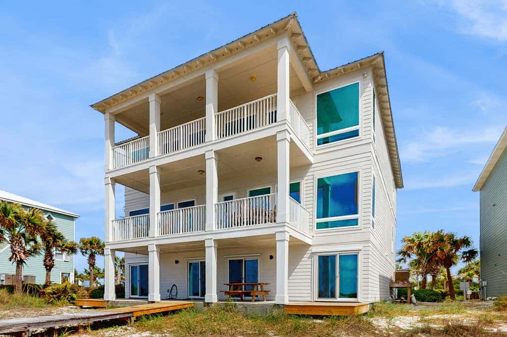 Spacious beachfront wedding-friendly home with multiple decks & shared pool