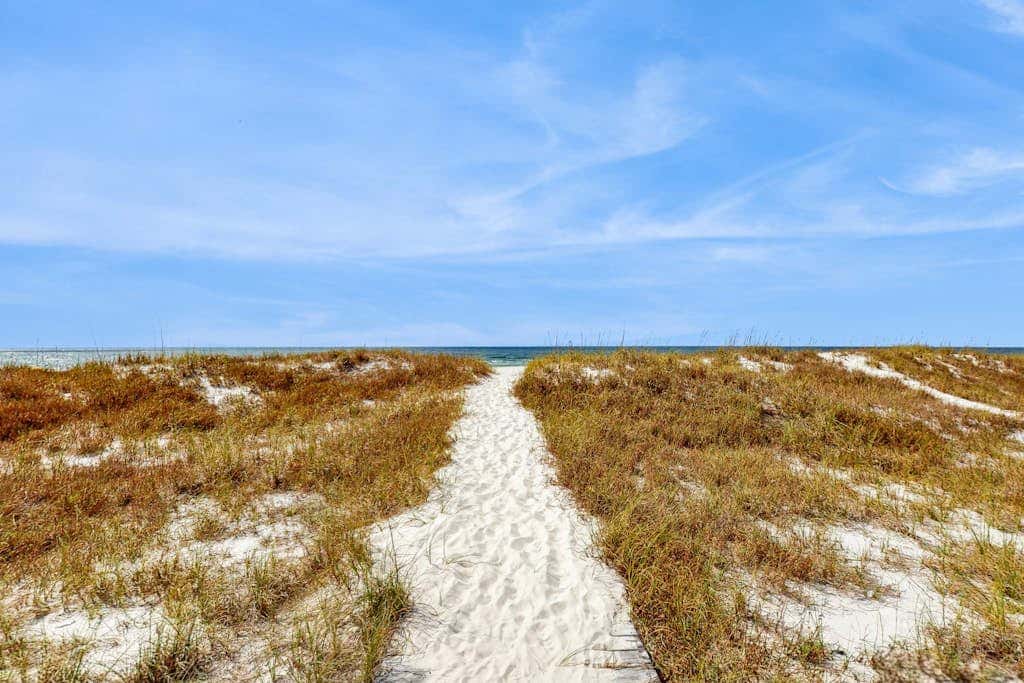 Spacious beachfront wedding-friendly home with multiple decks & shared pool