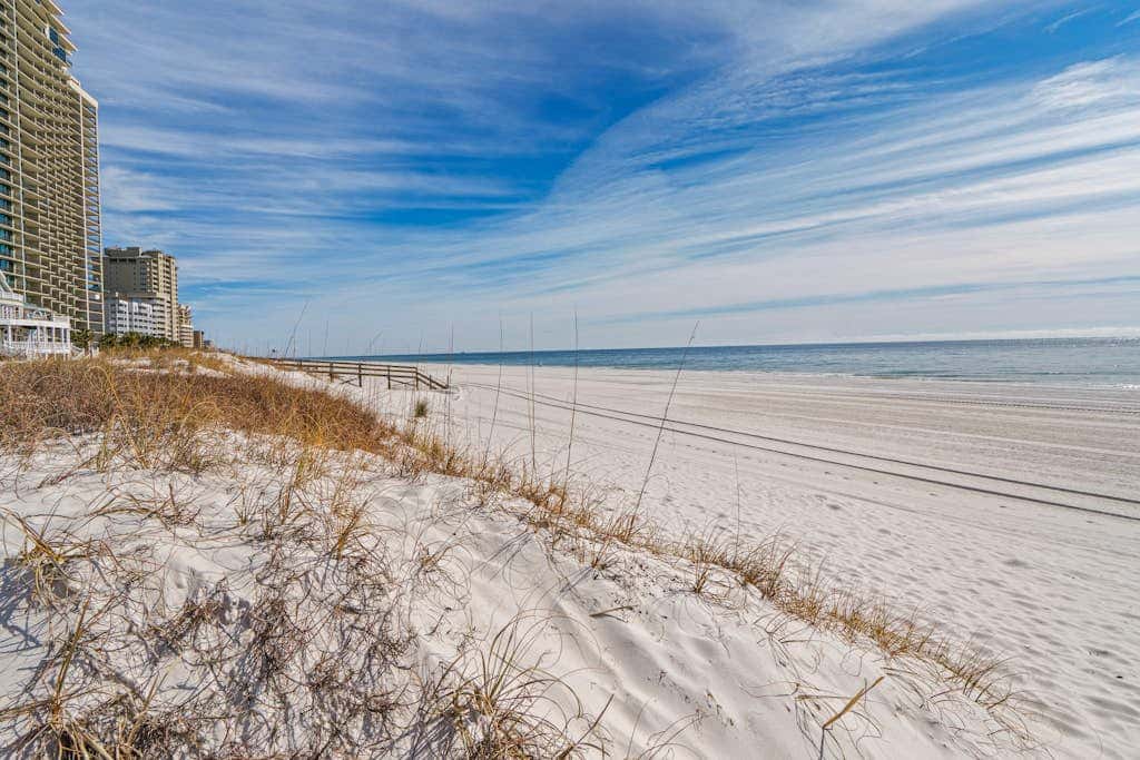 Spacious beachfront wedding-friendly home with multiple decks & shared pool