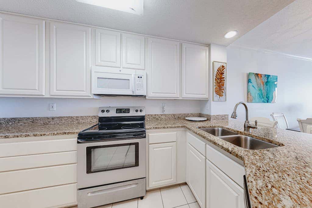 Beachfront resort condo with shared pool, tennis court, free WiFi, central AC
