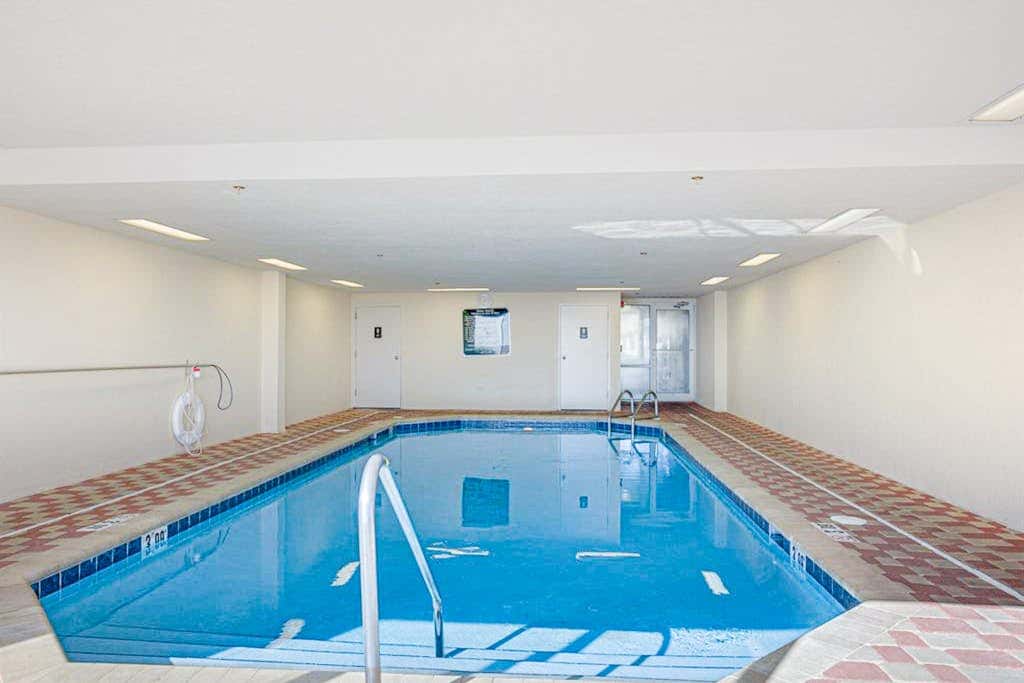 Beachfront resort condo with shared pool, tennis court, free WiFi, central AC