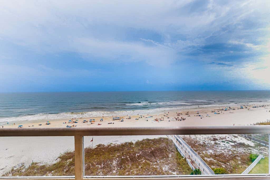 Beachfront resort condo with shared pool, tennis court, free WiFi, central AC