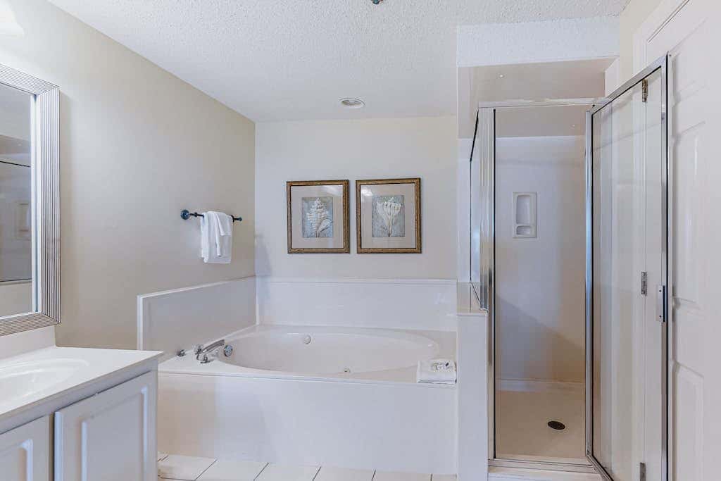 Beachfront resort condo with shared pool, tennis court, free WiFi, central AC
