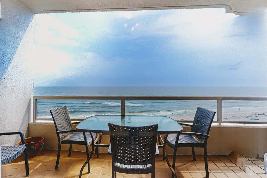 Beachfront resort condo with shared pool, tennis court, free WiFi, central AC