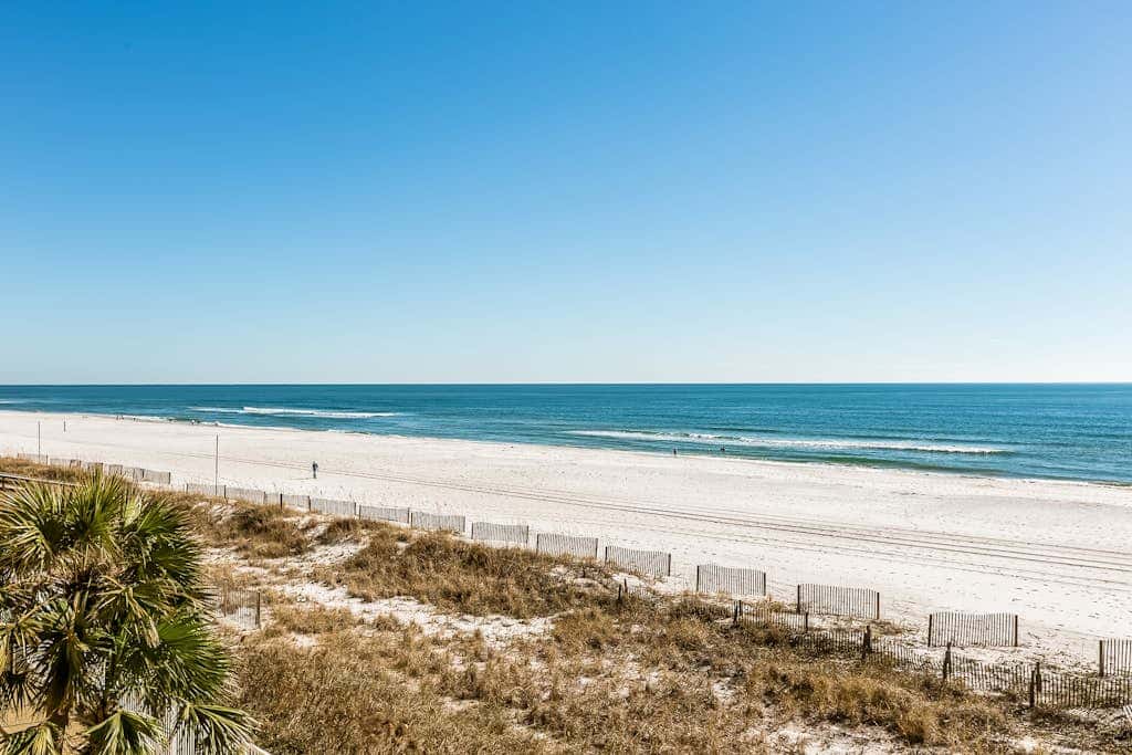 Beachfront resort condo with shared pool, tennis court, free WiFi, central AC