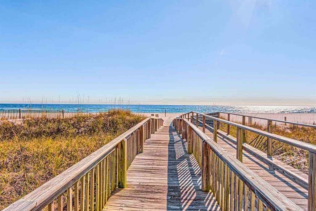 Beachfront resort condo with shared pool, tennis court, free WiFi, central AC