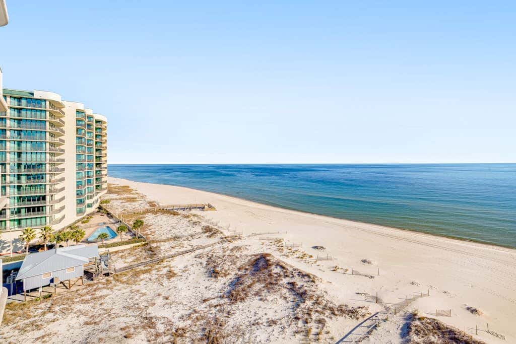 Gulf-front condo with balcony, central AC, pools, hot tubs & beach access