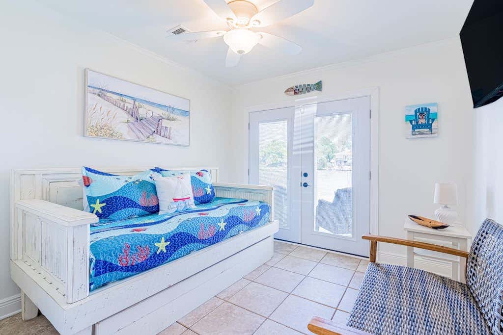 Bayfront beauty with a pool, grill, dock, reading room, board games, & AC