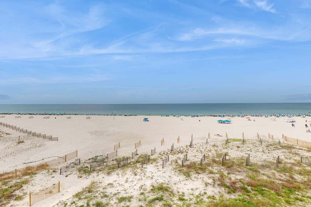 Beachfront condo with shared Gulf front outdoor pool, heated indoor pool, & sauna