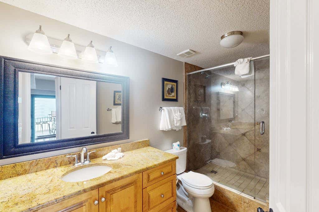 Beachfront condo with shared Gulf front outdoor pool, heated indoor pool, & sauna